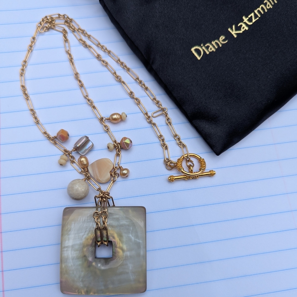 Elegant Gold and Cream Necklace with Pendant